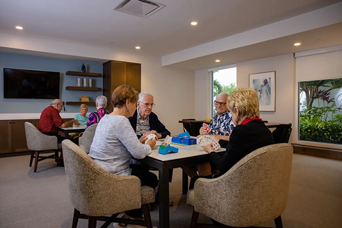 Enjoying game night with friends and neighbors.