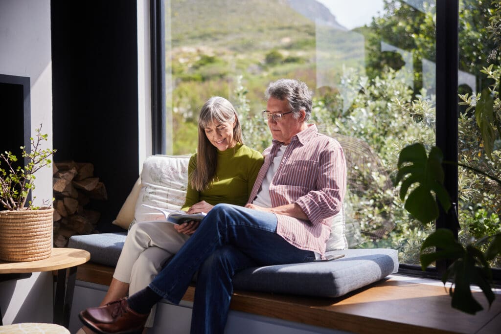 Seniors talking in windowsill