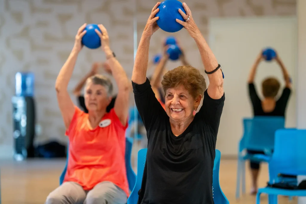 senior women in a exercise class at Amavida, an active resort-style senior community in Fort Myers, FL.